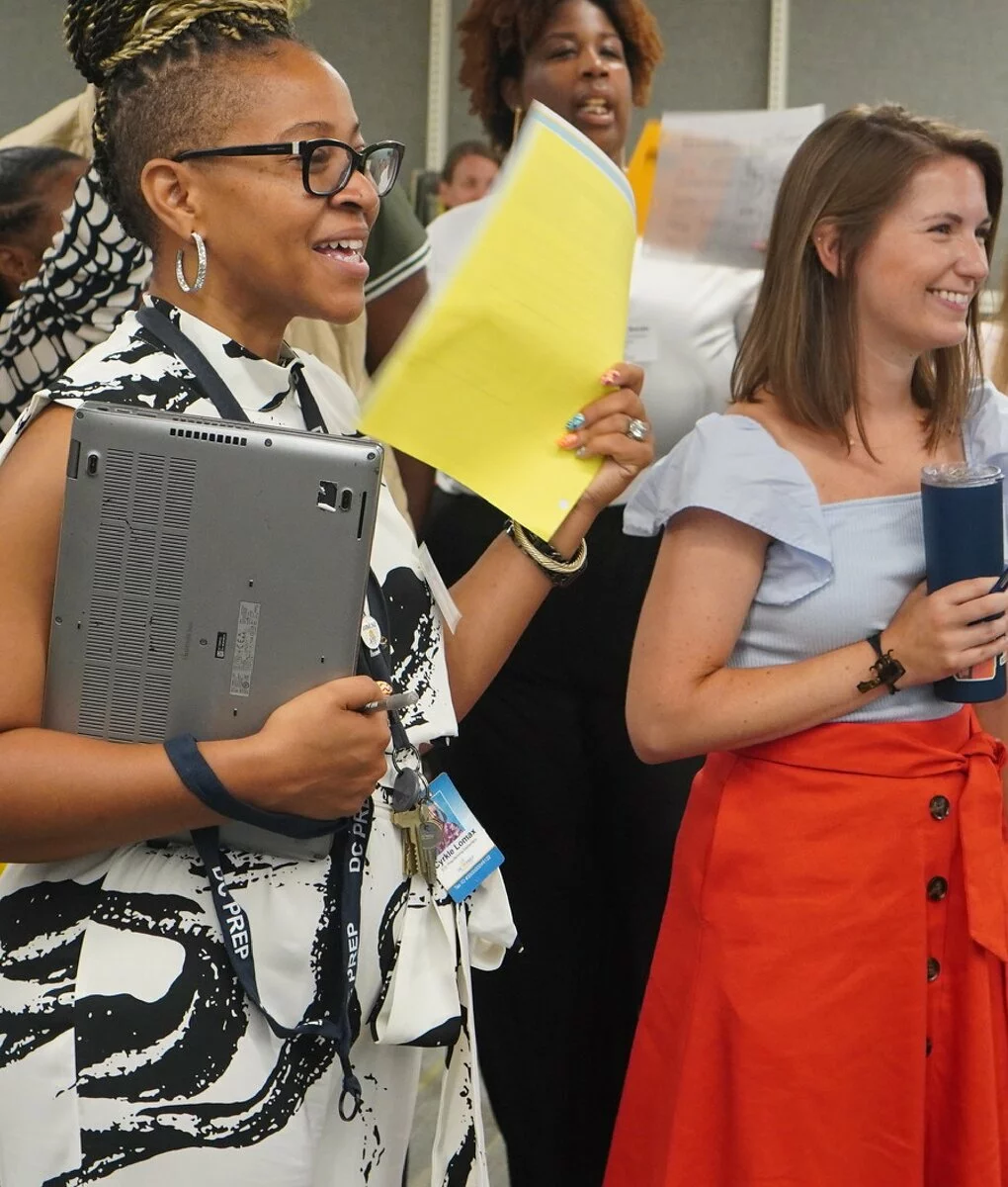 Two female educators smiling